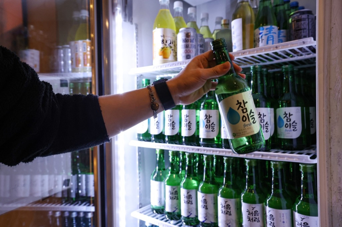Bottles of soju in a restaurant refrigerator in Seoul