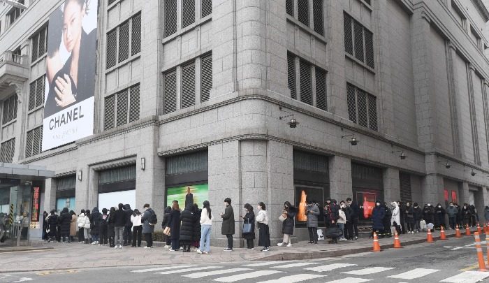 Shoppers line up outside the Chanel store of Shinsegae Department Store's main branch
