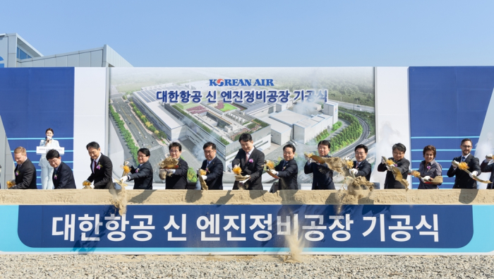 Hanjin Group Chairman Cho Won-tae (center) and other participants shovel soil during a groundbreaking ceremony for a new aircraft engine MRO cluster in Incheon, Korea