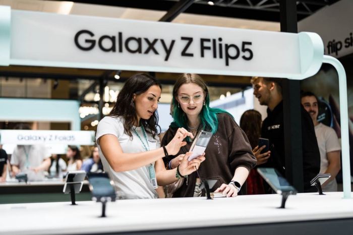 Visitors to Samsung's Galaxy Experience Space in Berlin test the Z Flip5 smartphone in August 2023