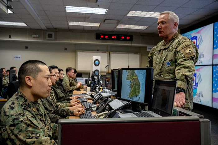 Gen.　Paul　J.　LaCamera　overlooks　operations　at　Command　Post　Tango.