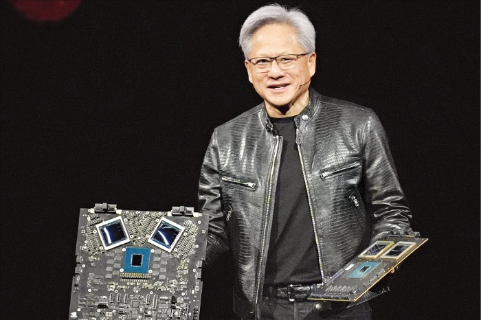 Nvidia CEO Jensen Huang talks about processing units during the keynote address of GTC in San Jose, Calif., on March 18, 2024. (Courtesy of AP via Yonhap)
