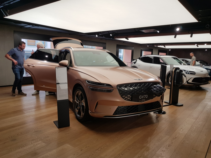 Visitors to Genesis Studio Munich examine Hyundai Motor cars under the premium Genesis brand in June 2023