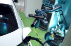 Doosan, LG unveil automated EV charger served by robot