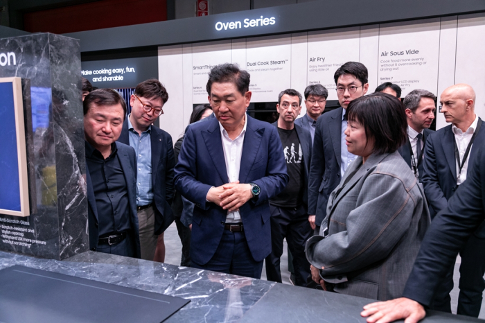 Han Jong-hee (center), vice chairman and head of Samsung's Device eXperience (DX) division, at EuroCucina 2024