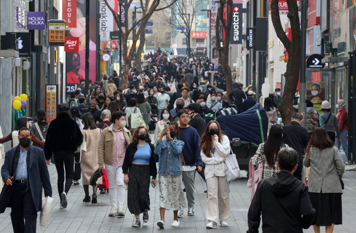 Shoppers and tourists in the Myeong-dong shopping district