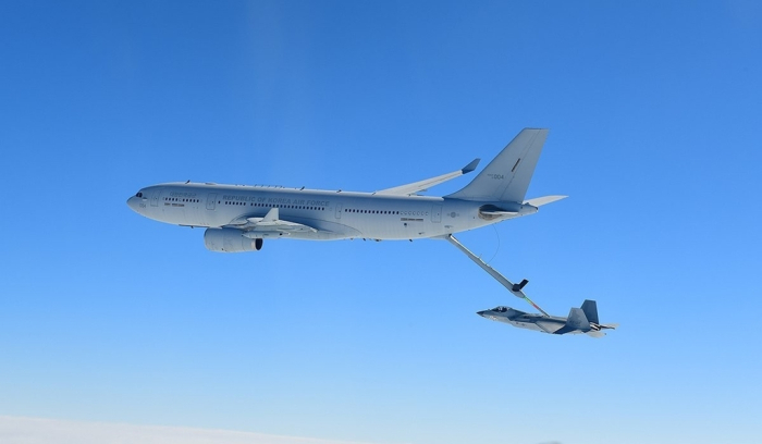 This undated photo by DAPA shows a KF-21 fighter jet undergoing an air-to-air refueling drill over waters off South Korea’s southern coast