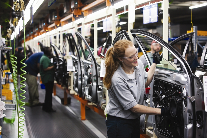 Workers on a car assembly line at Hyundai Motor Manufacturing Alabama