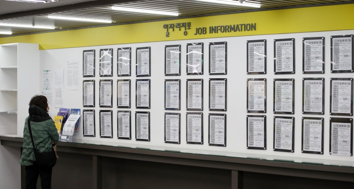 A person looks at job ads at an employment information center in Seoul on March 13, 2024 (File photo, courtesy of News1)