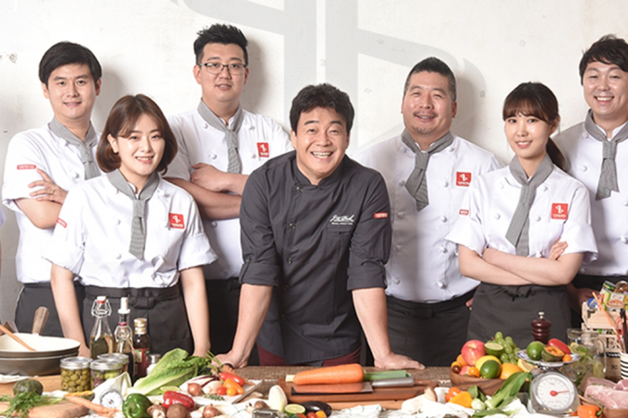Paik Jong-won (center), CEO of TheBorn Korea, a South Korean food and beverage company