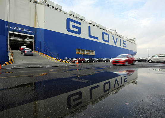 Automobiles loading onto a car carrier operated by Hyundai Glovis