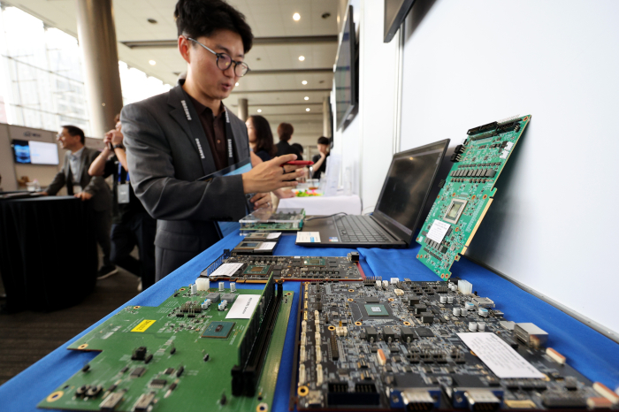 A Korean chip developer displays printed circuit boards