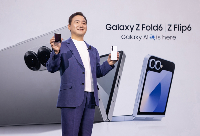 TM Roh, Samsung's mobile business chief, unveils the Galaxy Z Fold6 and Flip6 at the Galaxy Unpacked 2024 in Paris