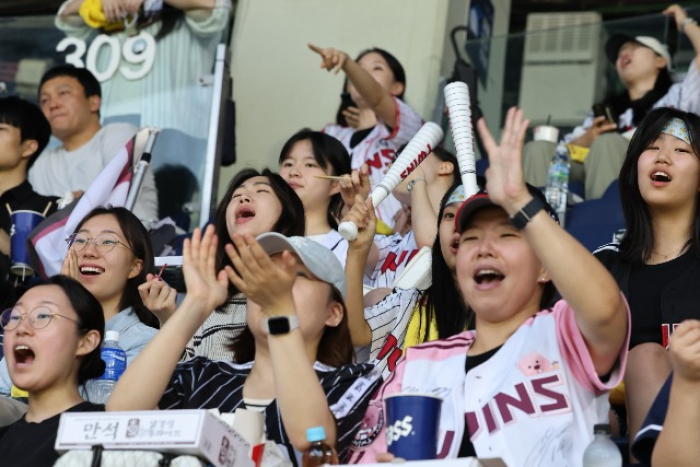 LG Twins' pro baseball team fans cheer at Jamsil Baseball Stadium on July 9, 2024