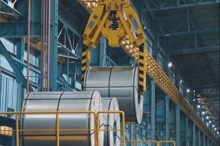 An unmanned steel mill crane moves steel coils at a POSCO steel plant