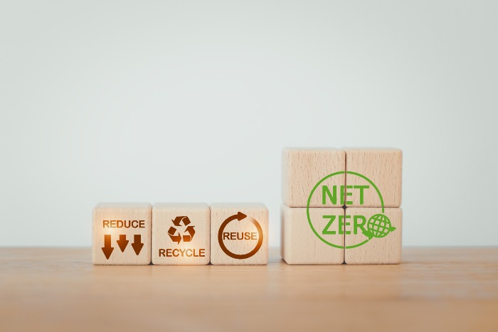 Wooden block with green net zero icon (Courtesy of Getty Images)
