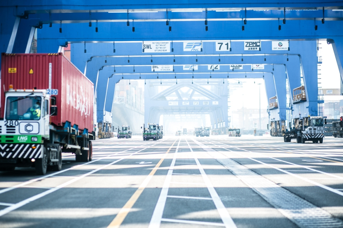 Trucks carrying container boxes to the PNC Terminal at the Port of Busan