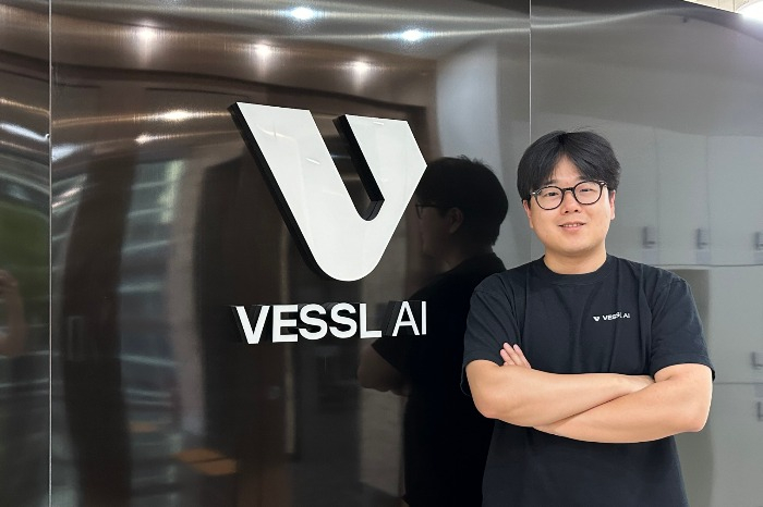 Vessl AI CEO An Jaeman poses for a photo in front of Vessl AI's office in Seoul, South Korea (Courtesy of Vessl AI)