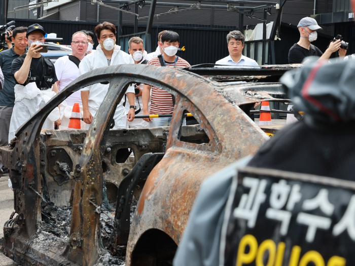 Korean police alongside foreign and local forensic investigators probe the fire involving a Mercedes-Benz EV in Incheon, Korea