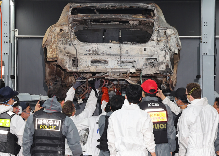 Police investigate the cause of a fire involving a Mercedes-Benz EV in Incheon, Korea