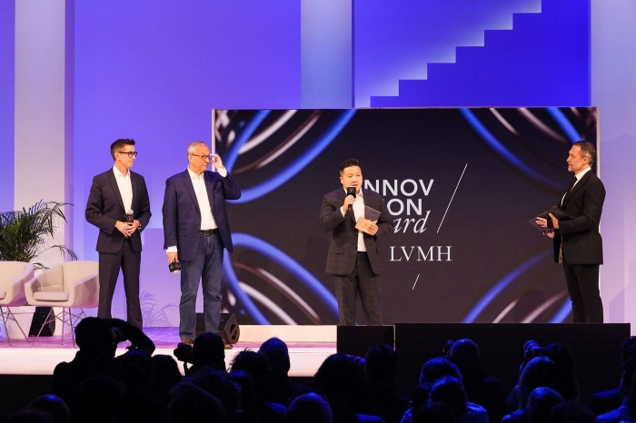 MarqVision　co-founder　and　CBO　DK　Lee　(second　from　right)　speaks　on　the　stage　(Courtesy　of　MarqVision) 