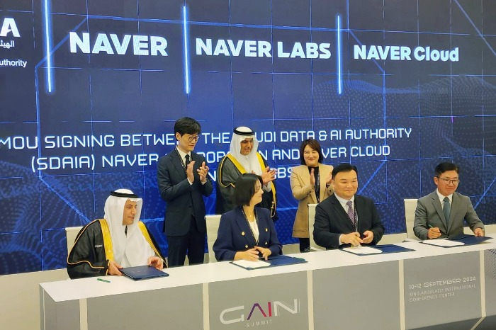 Esam Alwagait (far left), director of Saudi Arabia's National Information Centre and Naver CEO Choi Soo-yeon (second from left) sign an MOU for AI business cooperation on Sept. 10, 2024 in Riyadh