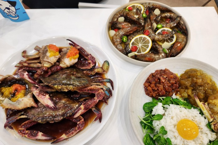 Soy sauce marinated crab and shrimp dishes on display at SIAL Paris 2024