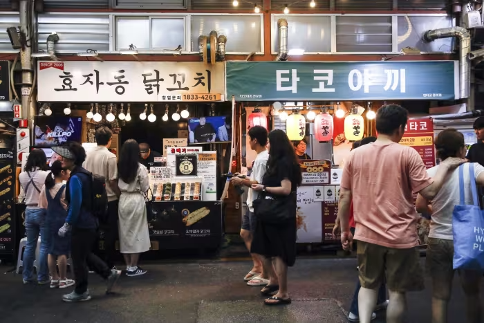 Private consumption picked up mildly, recovering from a contraction in the previous quarter. Photo: Woohae Cho/Bloomberg News