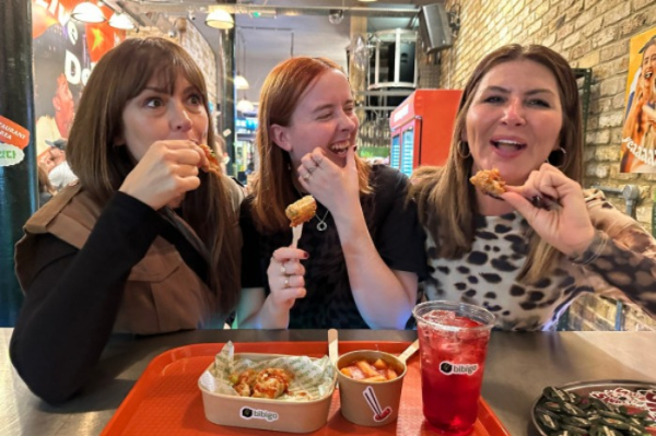 Customers share Korean dishes at the Bibigo to go pop-up store in Shoreditch, London (Courtesy of CJ CheilJEdang)