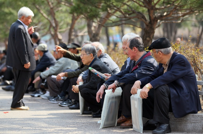 Elderly men at Tapgol Park in central Seoul