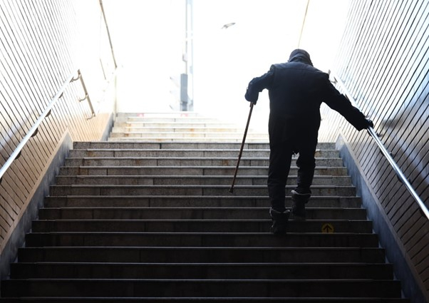 An elderly man walks up the stairs at a subway station in Seoul (Courtesy of Yonhap)