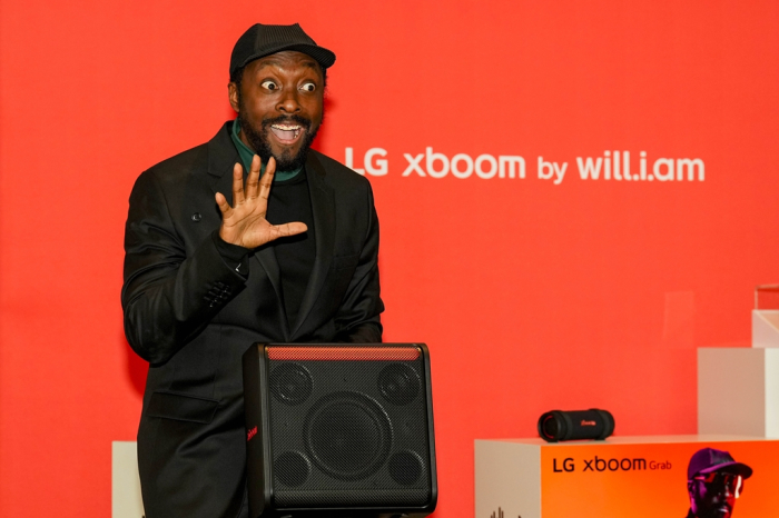 Artist will.i.am gets excited about the new LG xboom Stage 301 during a luncheon at CES 2025 on Jan. 6, 2025 in Las Vegas (Courtesy of AP)