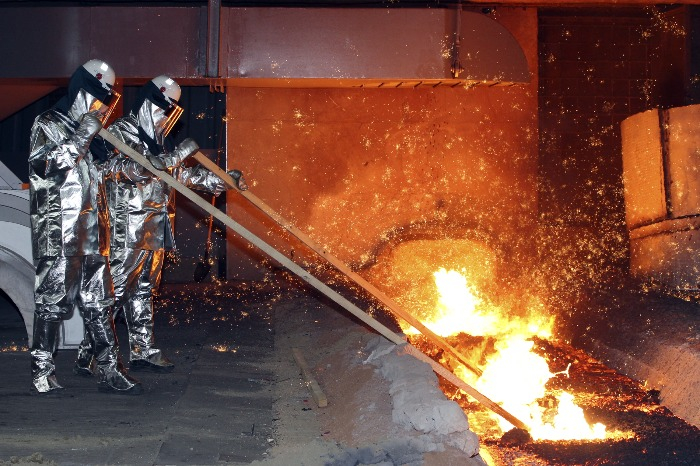Hyundai Steel employees smelt iron at a blast furnace (Courtesy of Hyundai Steel)