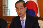Korean court reinstates impeached PM Han as acting president