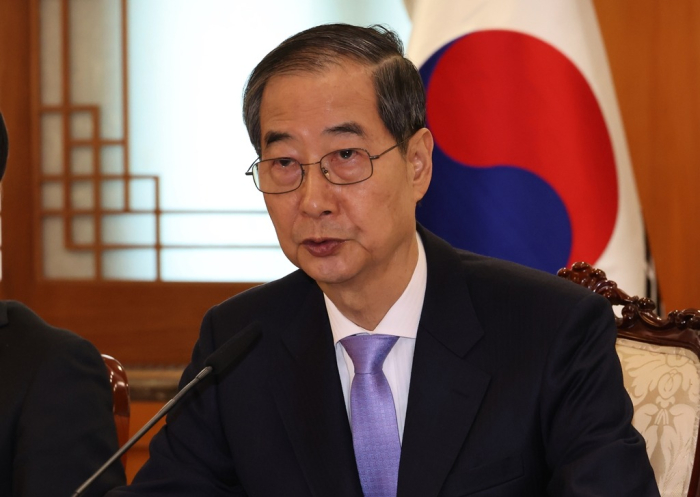 Han Duck-soo, South Korea's acting president and prime minister, speaks during a cabinet meeting at the Government Complex Seoul on March 24, 2025, after the Constitutional Court rules for his reinstatement (Courtesy of Yonhap)