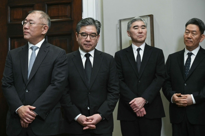 Hyundai Chairman Chung Euisun (left) and other executives wait for a meeting with President Donald Trump at the White House where Hyundai unveiled a billion US investment plan in March 2025 (Courtesy of Yonhap)