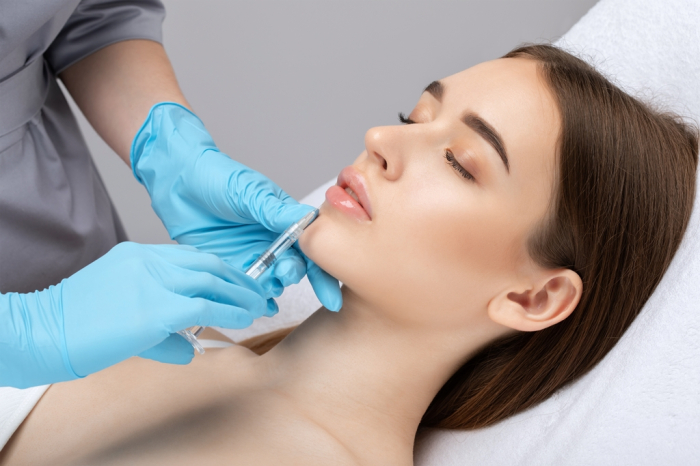 Cosmetologist does injections for lips augmentation and anti wrinkle therapy at an beauty salon (Courtesy of Getty Images)