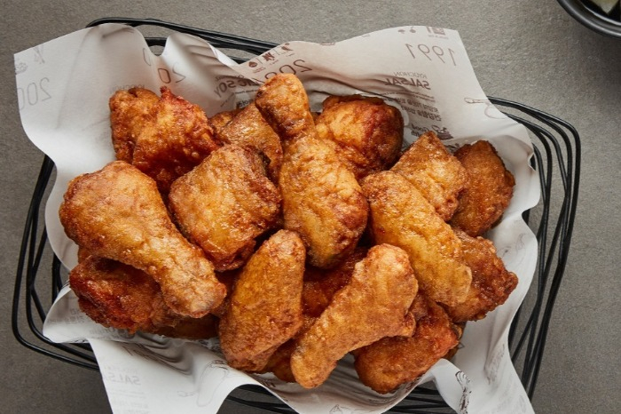 Kyochon's signature sweet and spicy fried chicken served in a basket