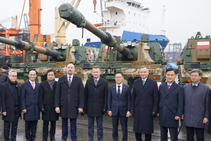 Government officials and business leaders at a ceremony for the arrival of Hyundai Rotem's K2 Black Panther tanks in Poland on Dec. 7, 2022