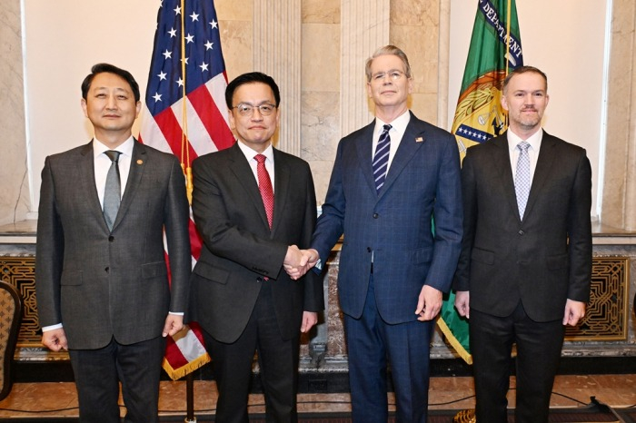 From left, South Korea's former Trade Minister Ahn Duk-geun, former Finance Minister Choi Sang-mok, US Treasury Secretary Scott Bessent and US Trade Representative Jamieson Greer pose for a photo prior to their trade talks in Washington on April 24, 2025