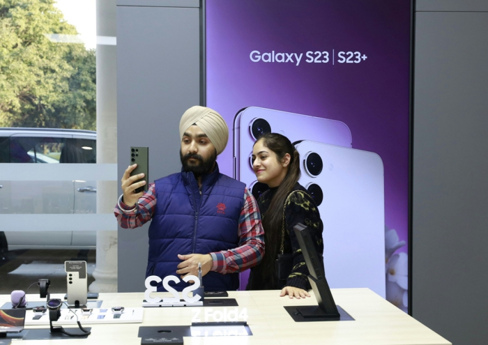 Customers try the Samsung Galaxy S23 smartphone in Bengaluru, India on March 17, 2023